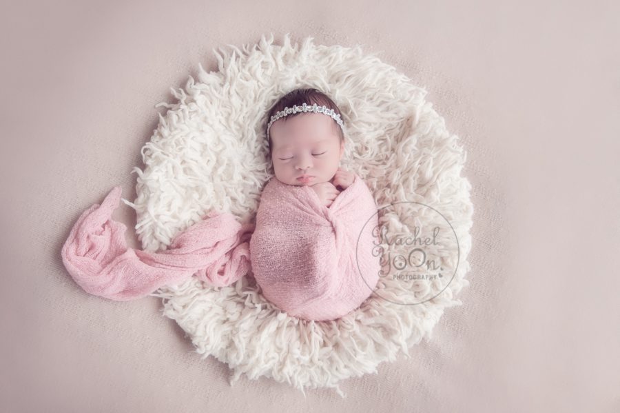 newborn baby girl in a pink wrap - newborn photography vancouver