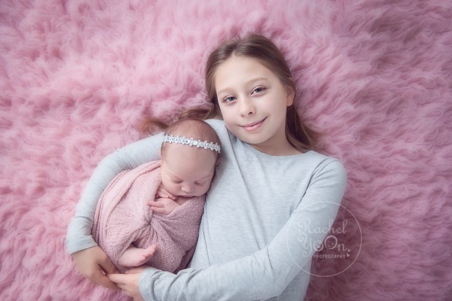 newborn baby girl with her sister - newborn photography vancouver