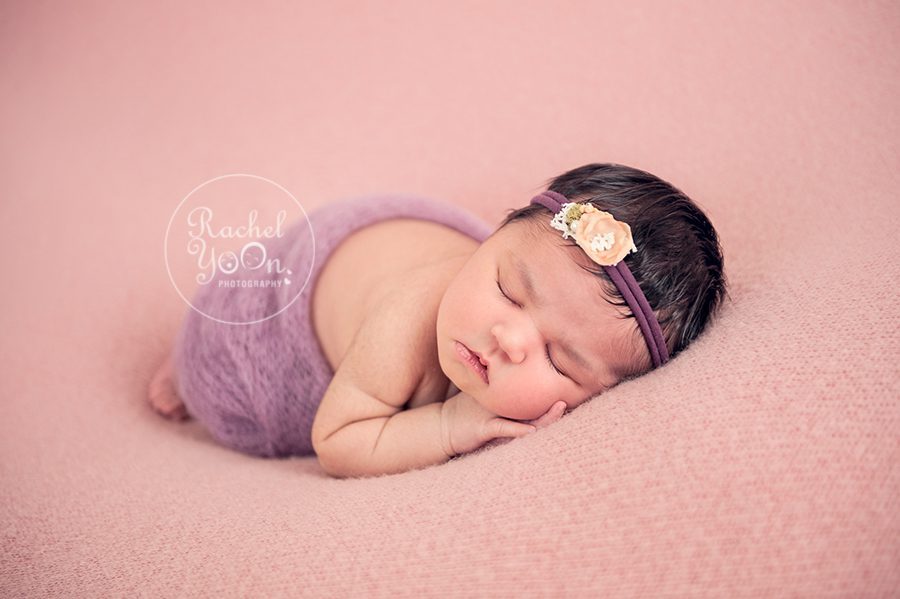 newborn baby girl in a purple wrap and headband - newborn photography vancouver
