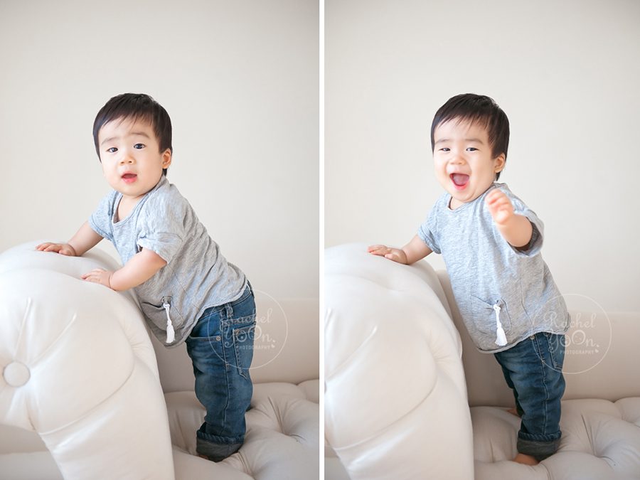 1 year old baby boy standing on a couch - baby photography vancouver