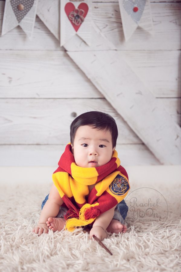6 months old baby boy with a Harry Potter scarf - baby photography vancouver