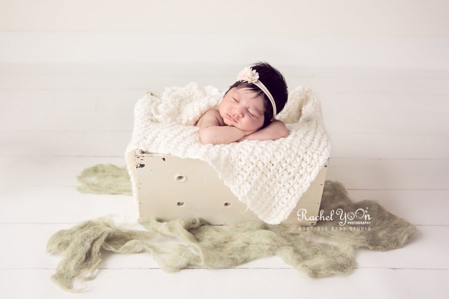 newborn baby girl in a white basket - newborn photography vancouver