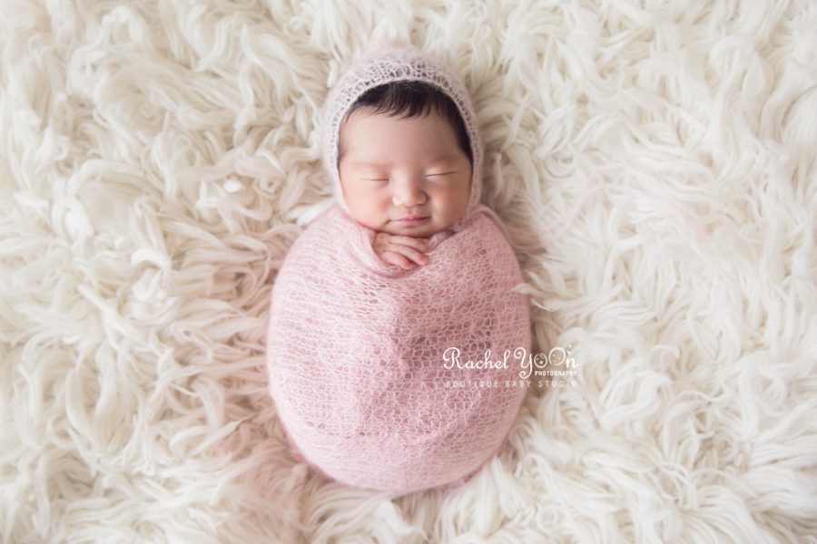 newborn baby wrapped in pink - newborn photography vancouver