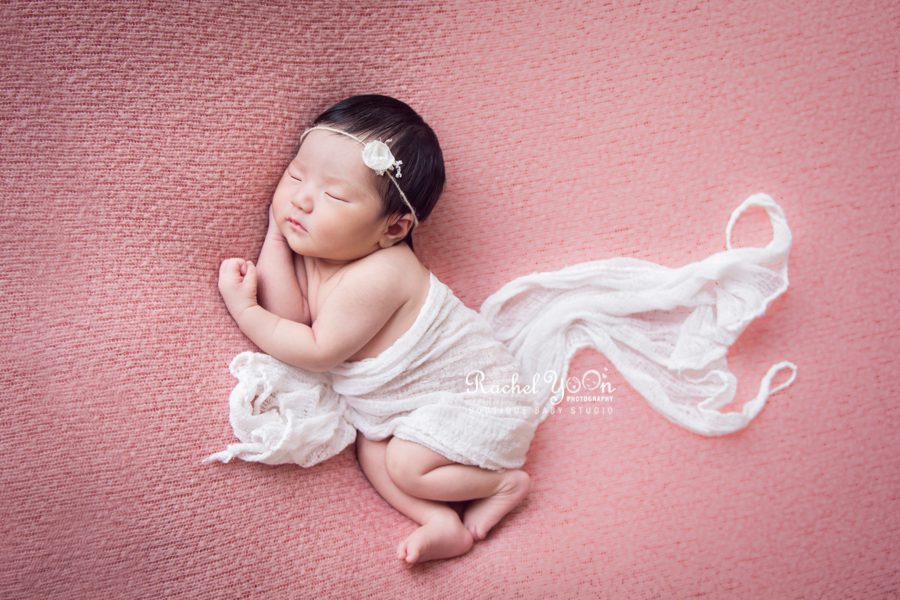newborn baby girl side pose with a wrap - newborn photography vancouver