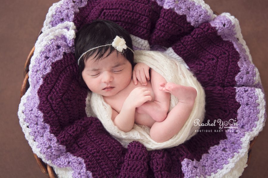 baby girl on the purple blanket that her grandma knitted - newborn photography vancouver