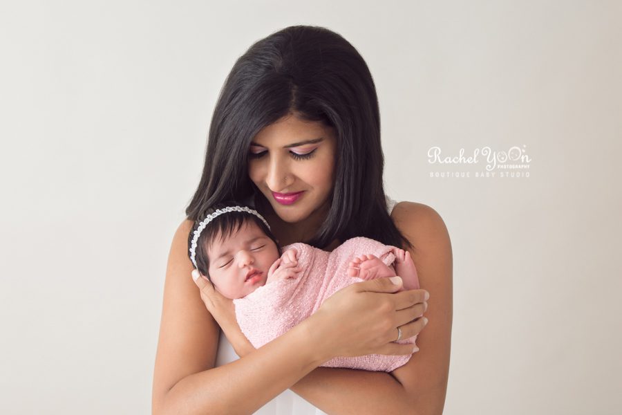 newborn baby girl held by her mom - newborn photography vancouver