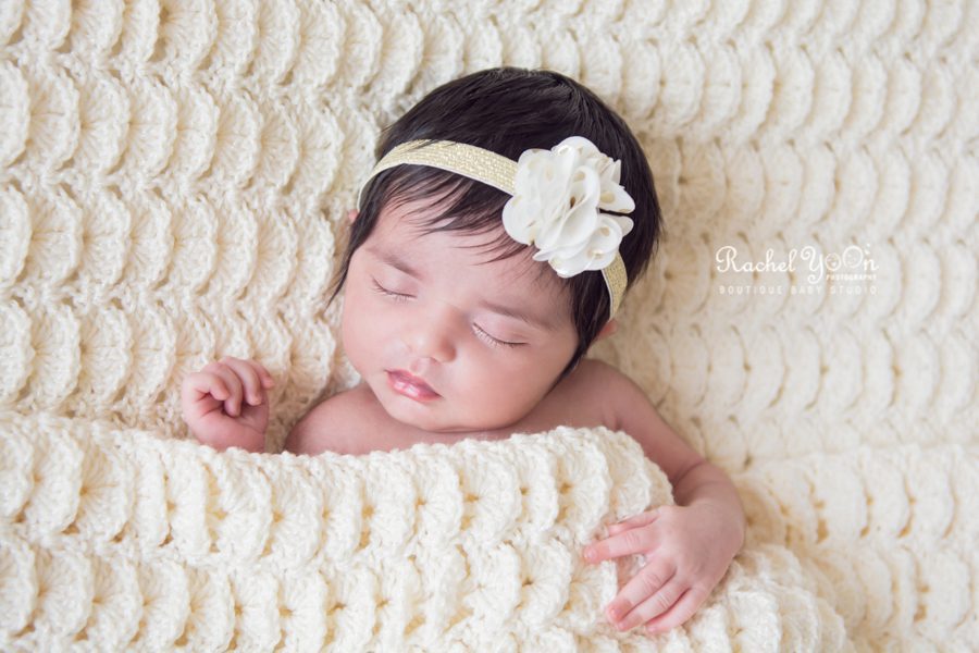 baby girl tucked in the blanket - newborn photography vancouver