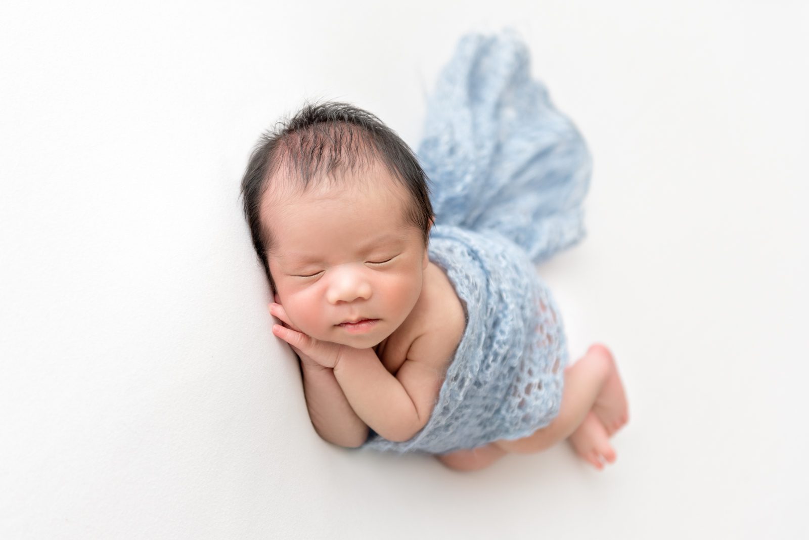 newborn baby boy side pose 